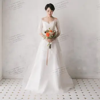 Cömert Aplike A-Line düğün elbisesi Mütevazı V Boyun Dantel Yarım Kollu Lace Up Geri gelinlikler Zarif Çim Gelinler Elbise TT144